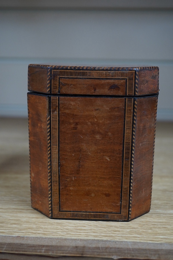 A George III Sheraton period octagonal West Indian satinwood and marquetry tea caddy, 12cm high. Condition - fair
